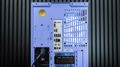 The rear view of a custom light blue computer case with a yellow circular 'H' logo, showing various ports, a power supply intake, and a hanging power cable against a dark gray ribbed background.