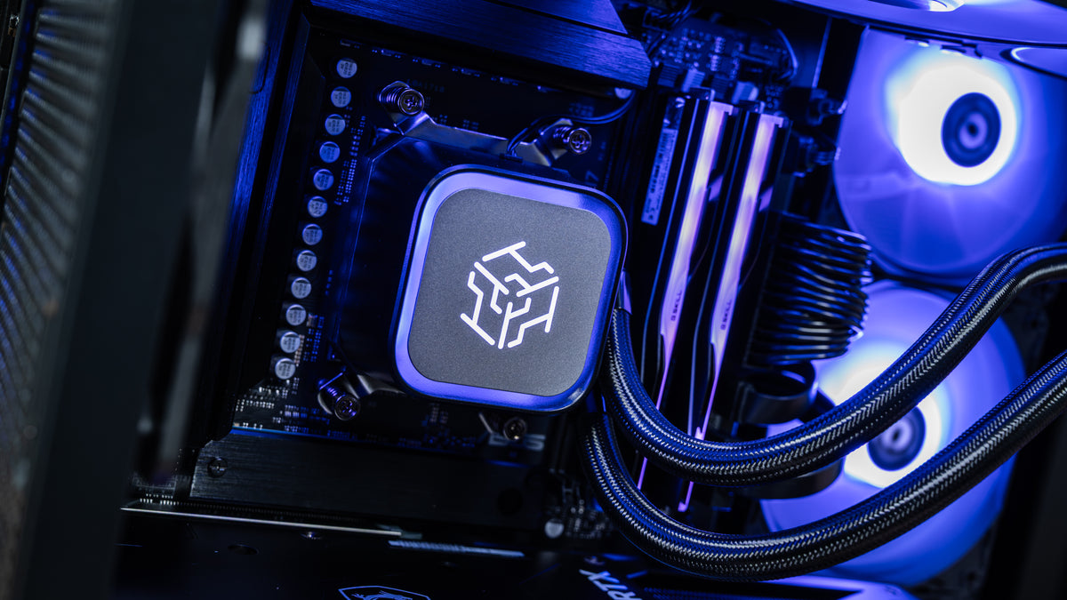 Detail of the 360mm liquid CPU cooler pump head with braided tubing and DDR5 RAM inside the PowerGPU Azul AMD Ryzen RTX 5090 gaming PC