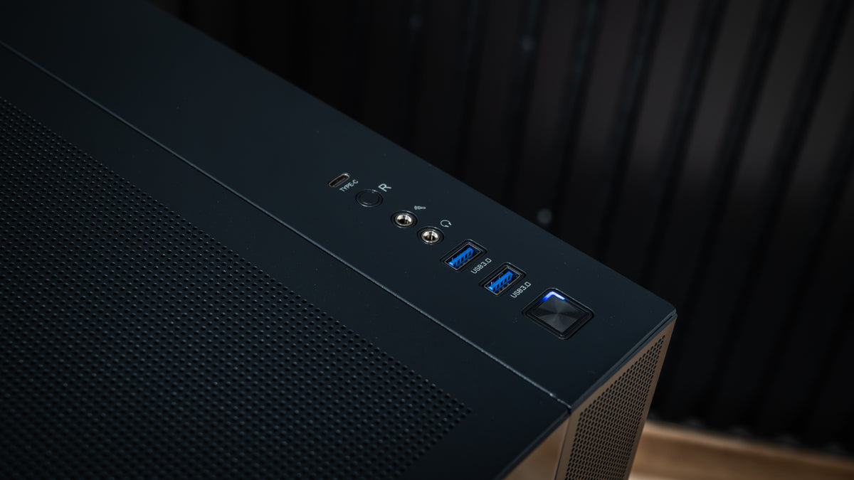 Top front I/O panel of the PowerGPU Azul gaming PC case with power button, USB-C and USB 3.0 ports, audio jack and mesh top dust filter