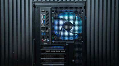 Rear view of the Night Hawk gaming PC showing motherboard I/O ports, Wi-Fi antenna connectors and blue-lit exhaust fan