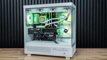 Snow Hawk white gaming PC front view with green RGB fans, tempered glass panels and GeForce RTX 5070 Ti