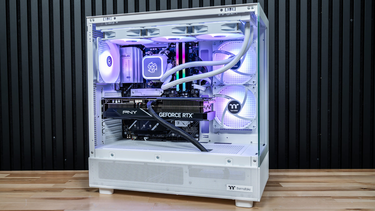 Snow Hawk white gaming PC with purple and white ARGB lighting, RTX 5070 Ti graphics card and white 360mm AIO cooler